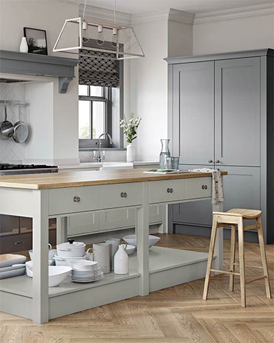 Traditional, featuring simple timber shaker doors painted with a matt finish. Timber block worktops and authentic hardware.