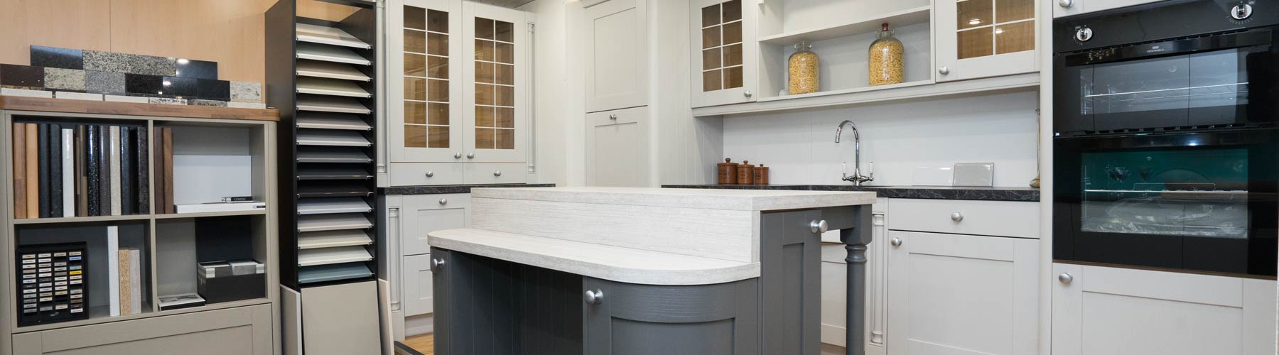 Shaker kitchen with light and dark grey doors on display in our showroom.