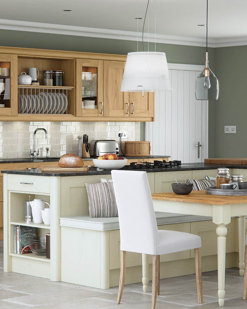 Contemporary, with oak base and wall cabinets and a cream island with granite top. Combining both traditional and modern styles to create a contemporary kitchen.