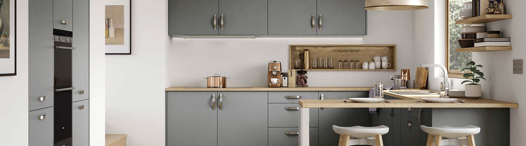 Matt slab grey contemporary kitchen with timber worktops.