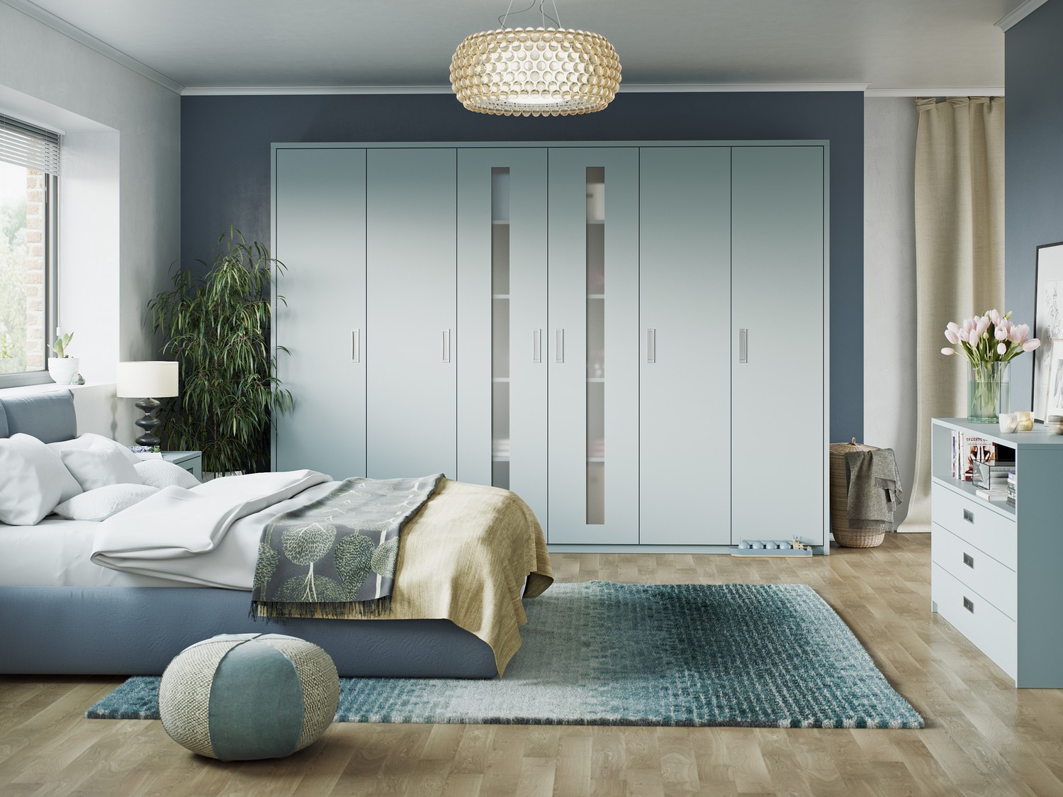 Matt powder blue fitted bedrooms Liverpool with integrated handle and frosted glass feature doors. This bedroom features a matching chest of drawers and has been designed for our client in Kirkby.